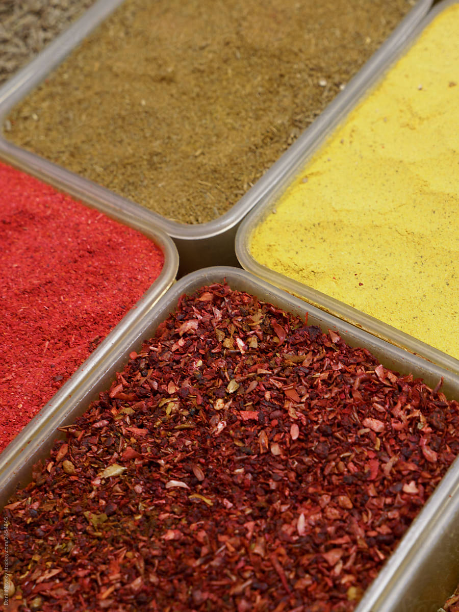Containers with spices on counter
