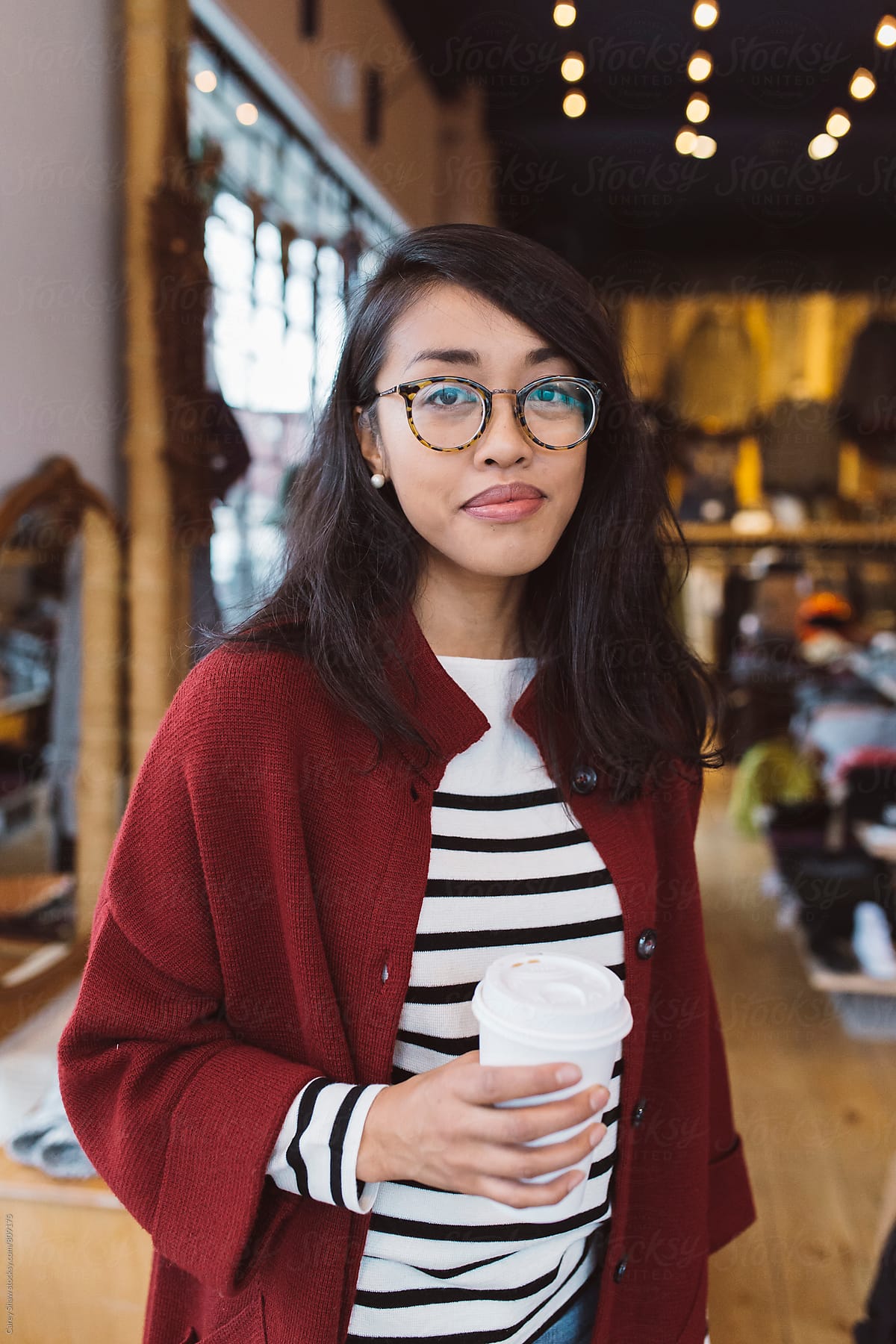 Portrait of stylish woman at local clothing store