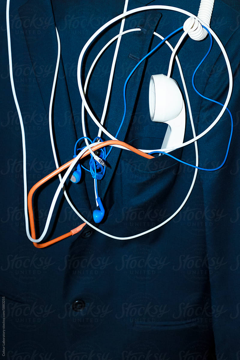 Office business style suit with landline, wires, headphones with flash