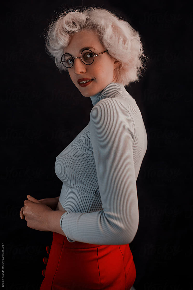 Blond girl curly hair portrait glasses casual portrait dark lips