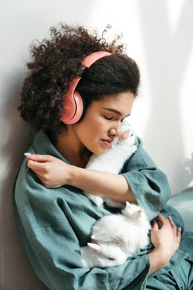 Young resting woman listens to music.