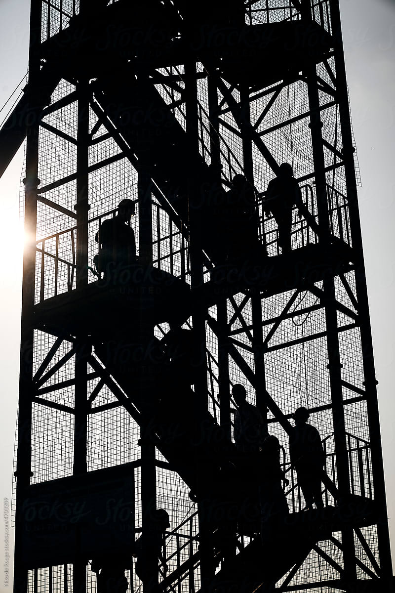 Workers climbing the stairs