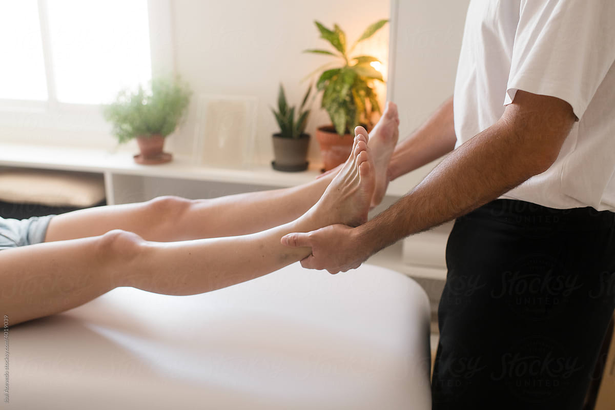 Anonymous osteopath working on an ankle