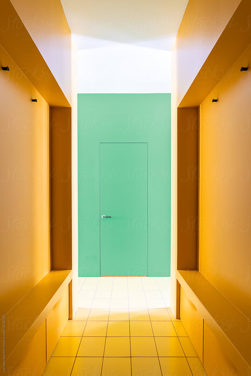 Orange corridor in the entrance hall of a colourful apartment