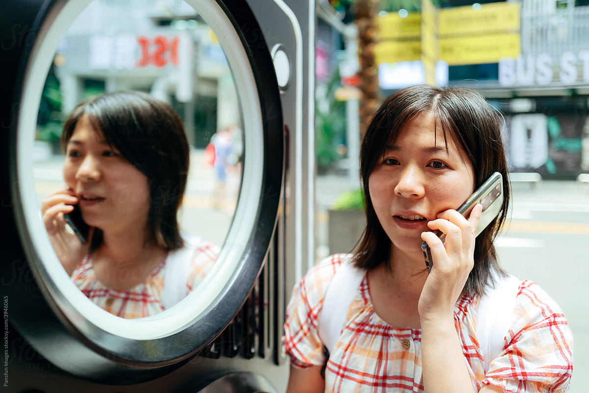 Asian women using cell phone
