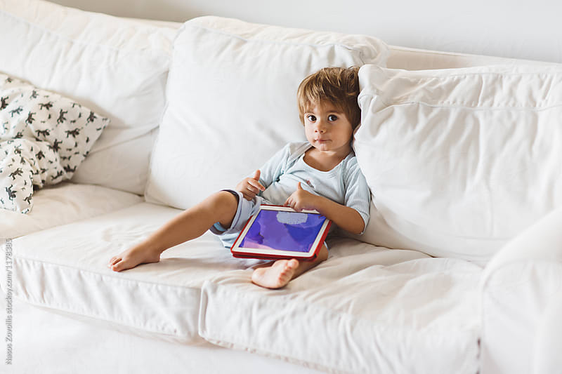 1 year old boy looking a digital tablet