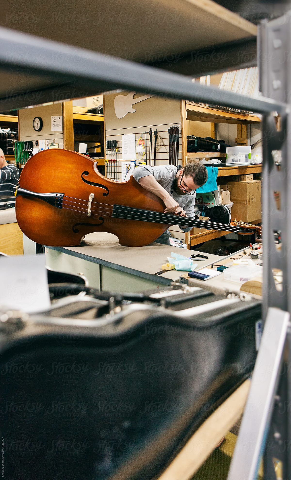 Band: View Of Man Repairing Bass Instrument