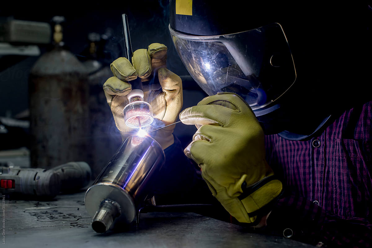 Man welding in his workshop