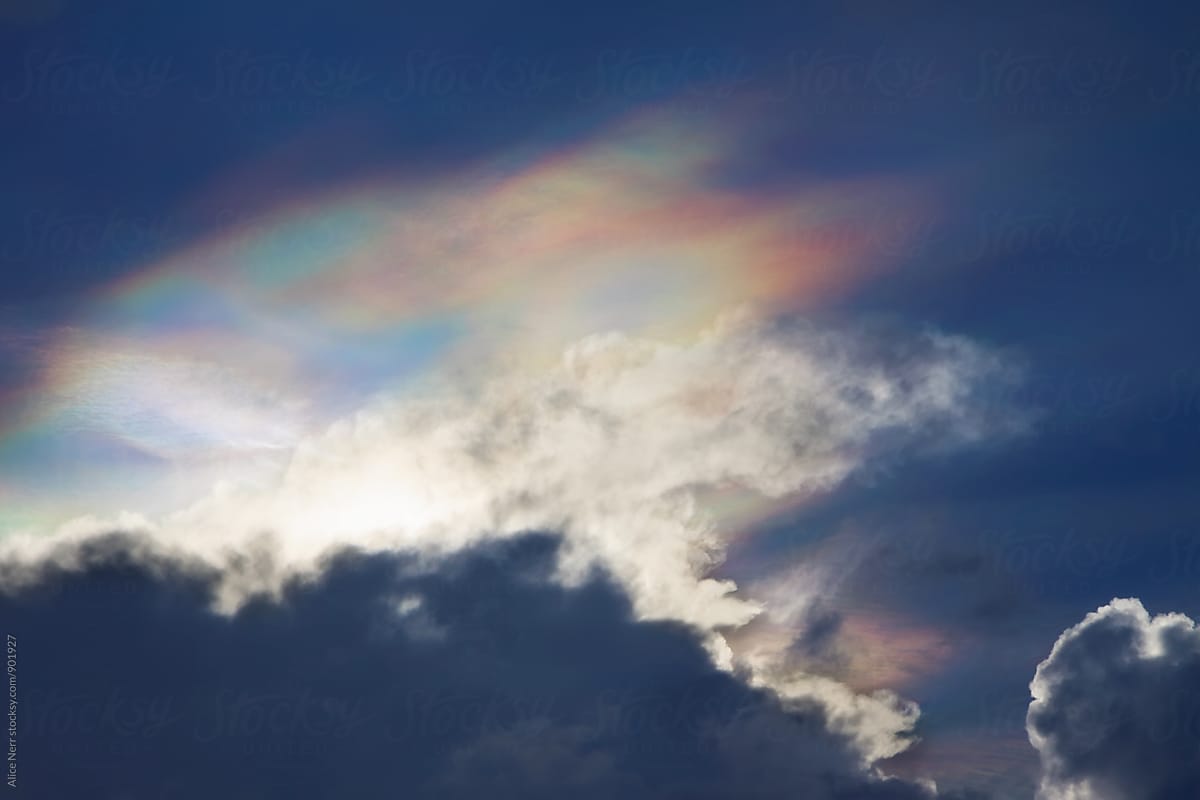 Fire rainbow above the clouds in blue sky