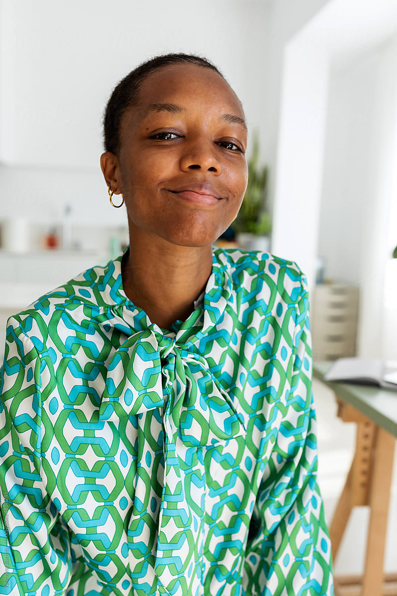 Smiling african woman in vintage blouse portrait