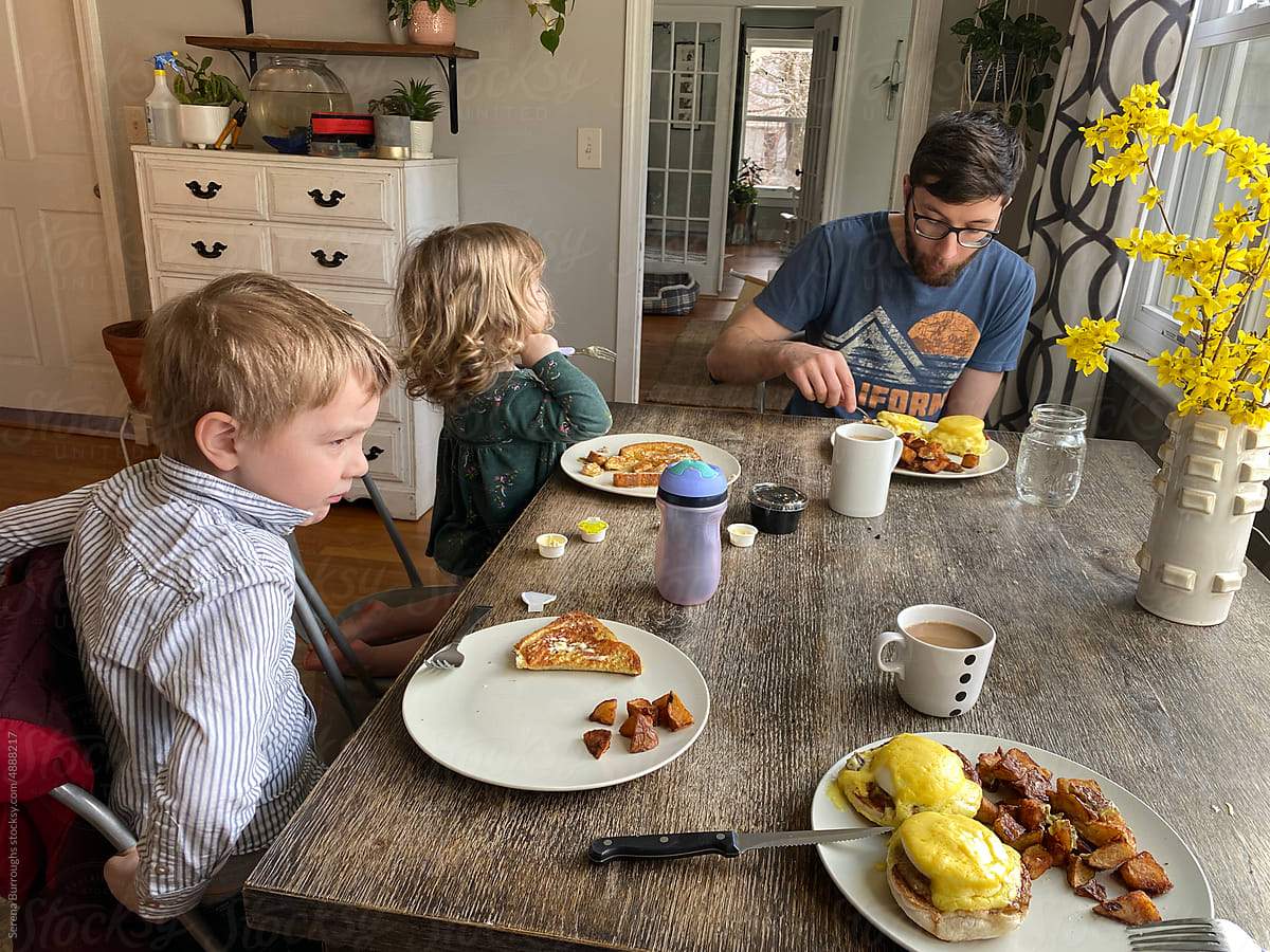 ugc of father and his children eating breakfast
