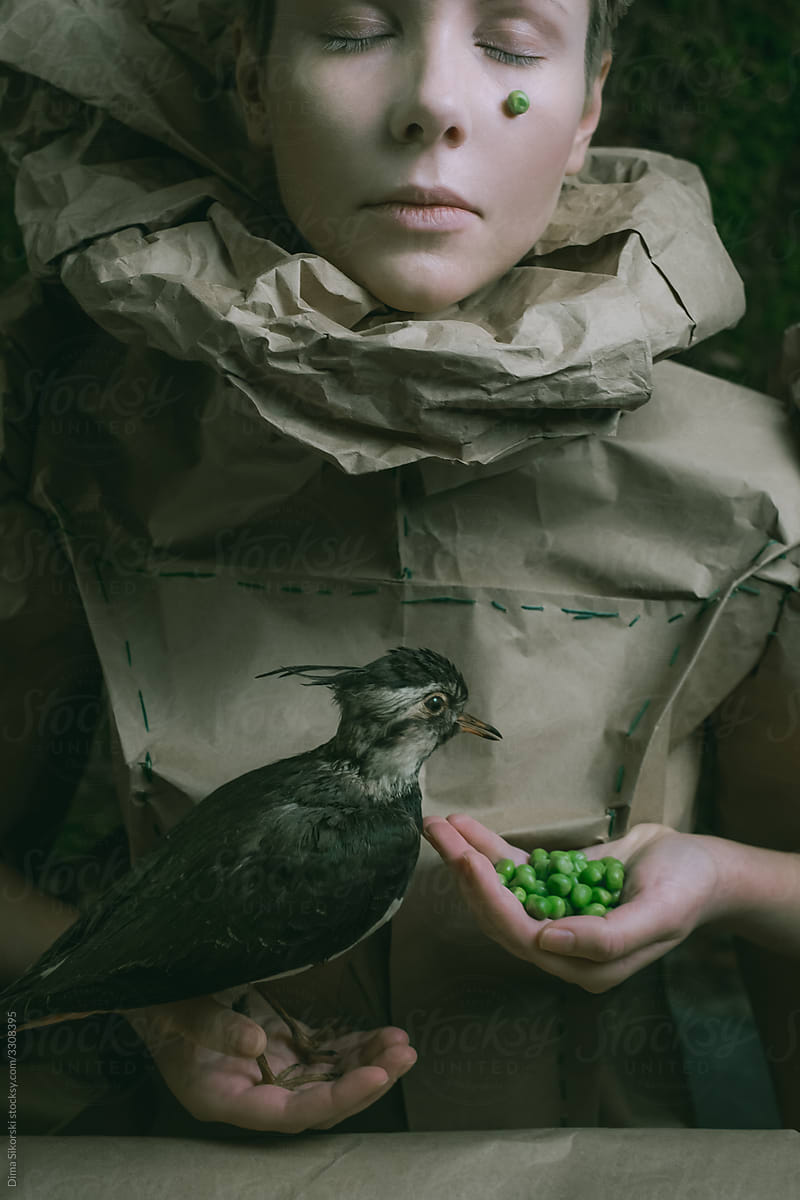 girl feeding a bird concept portrait