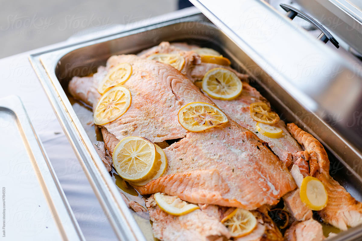 Tray of Salmon with Sliced Lemons at Wedding Reception