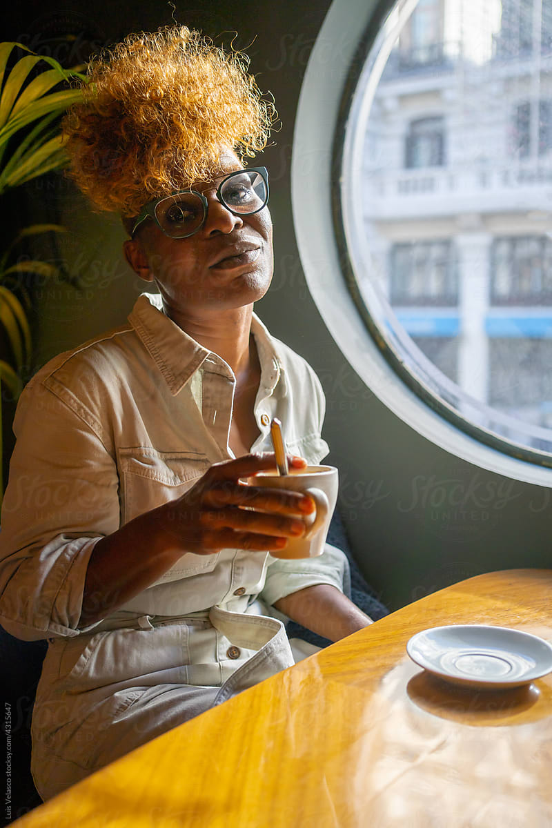 Portrait Of A Black Woman In A Cafe.