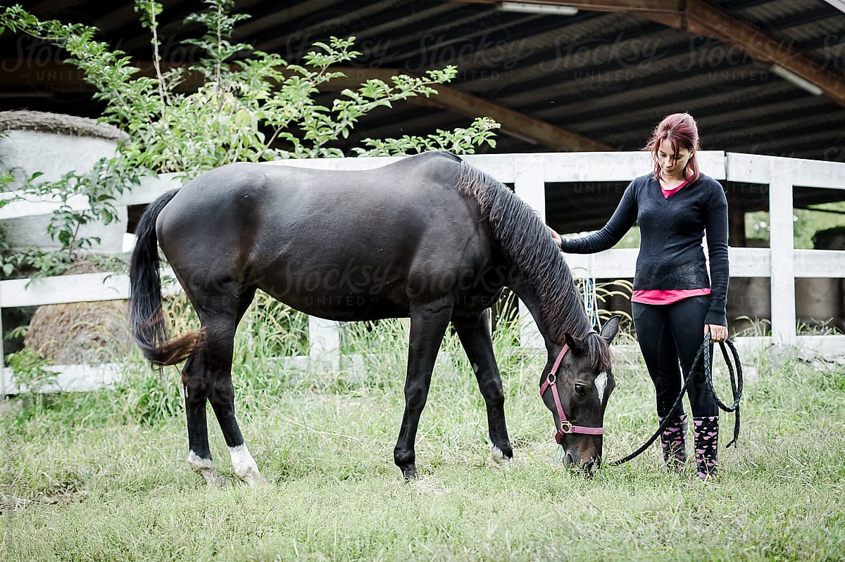 Woman and her horse at the stables