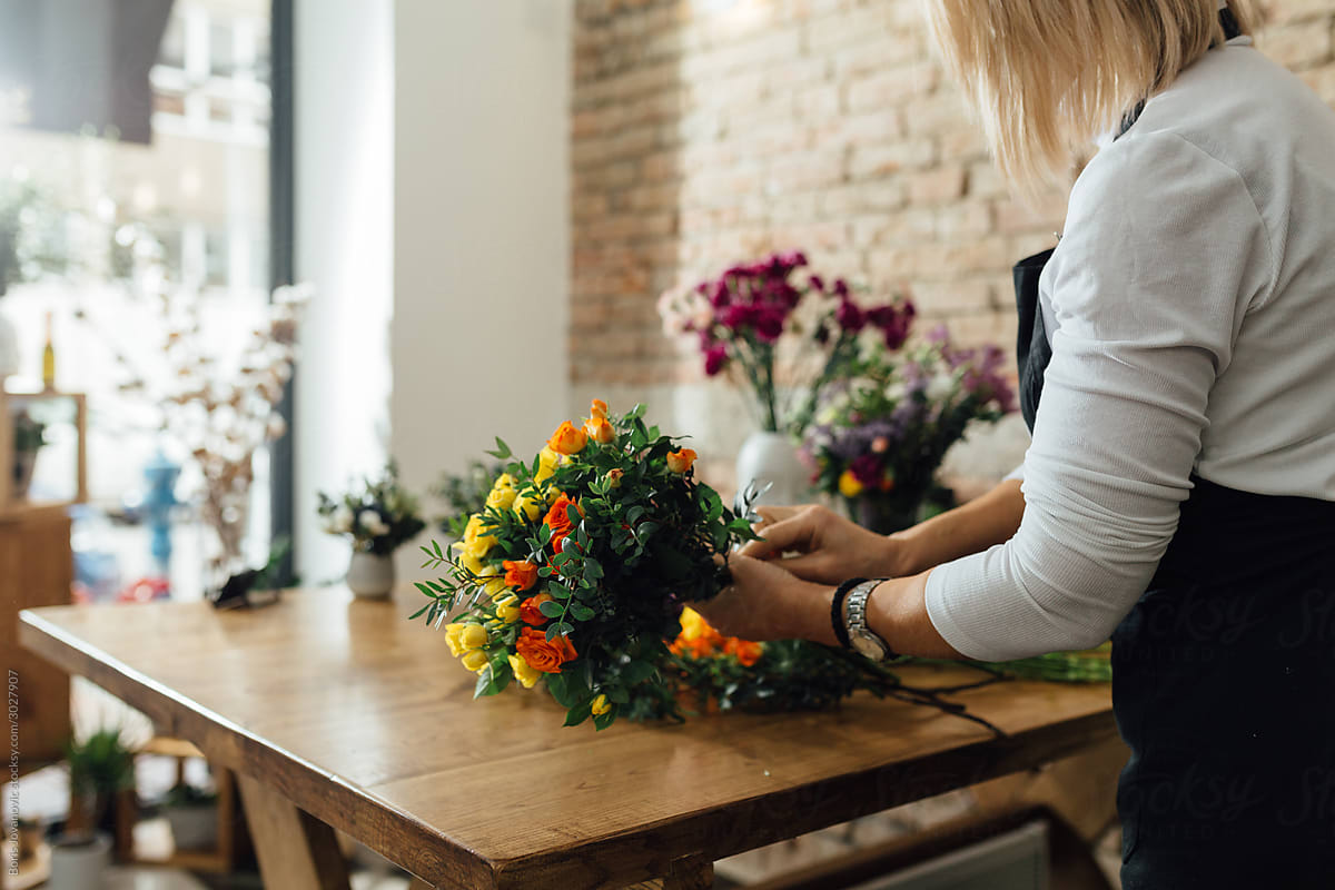 Anonymous Woman Arranging Bouquet Of Flowers