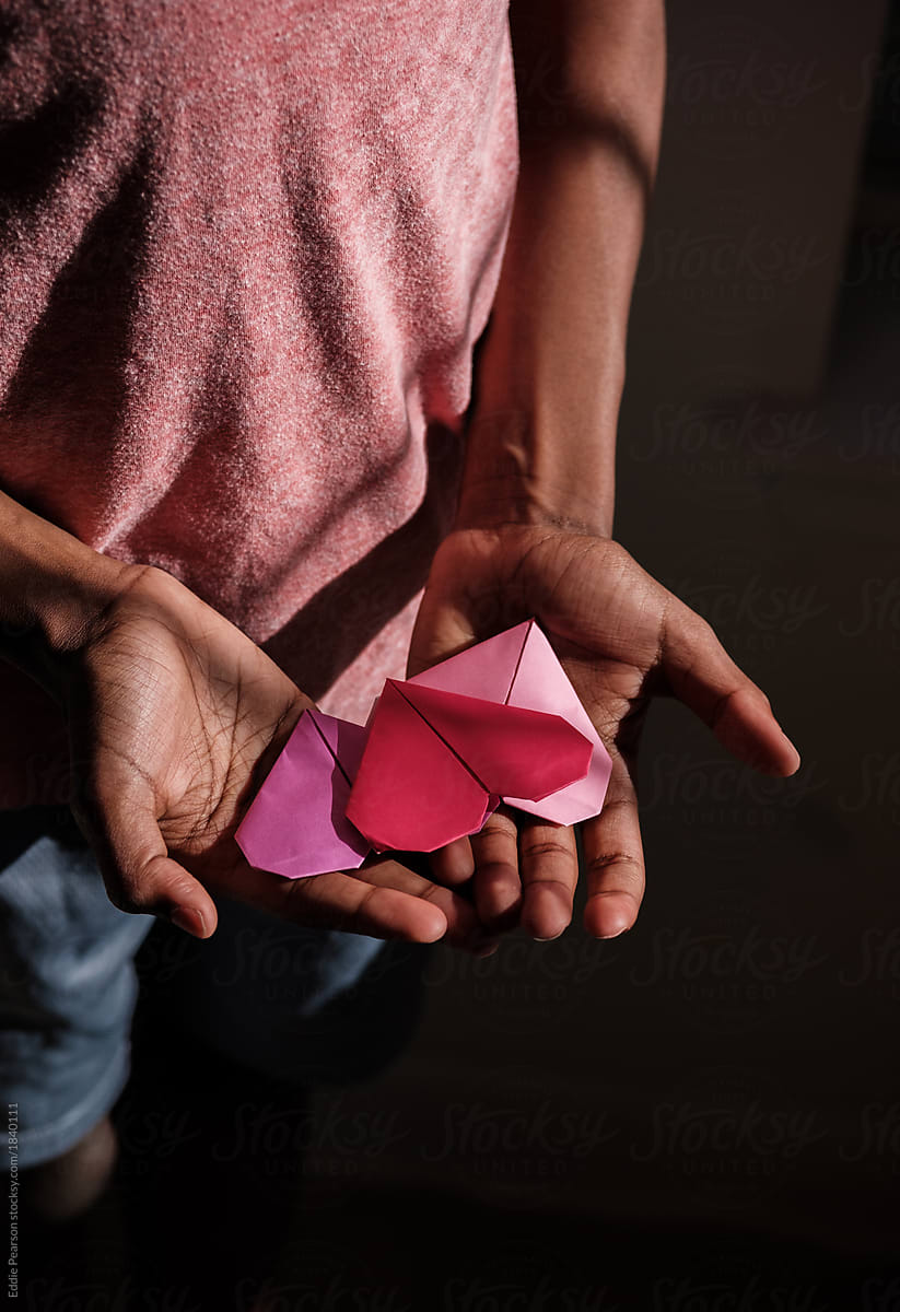 Young boy showing his Origami