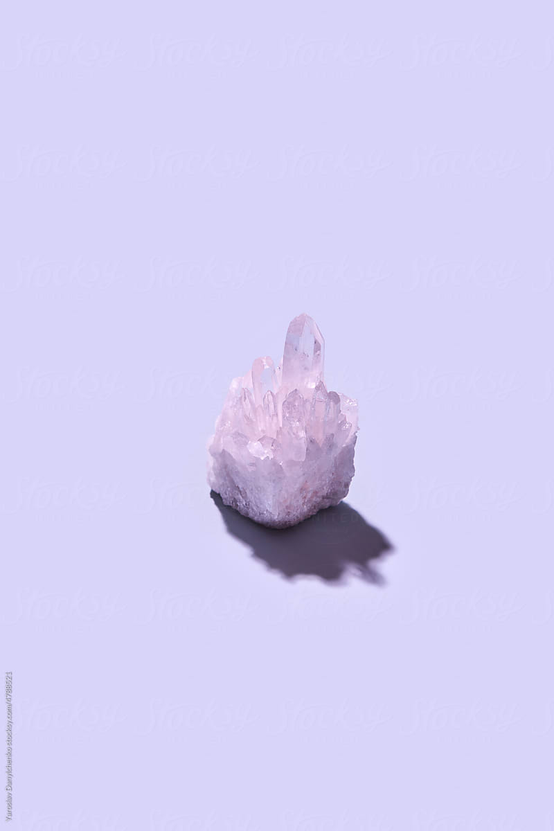 Amethyst crystal with on purple background