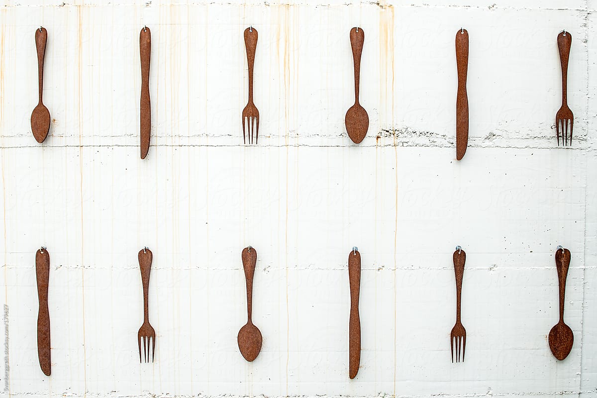 Cutlery on a white background - hanging on wall
