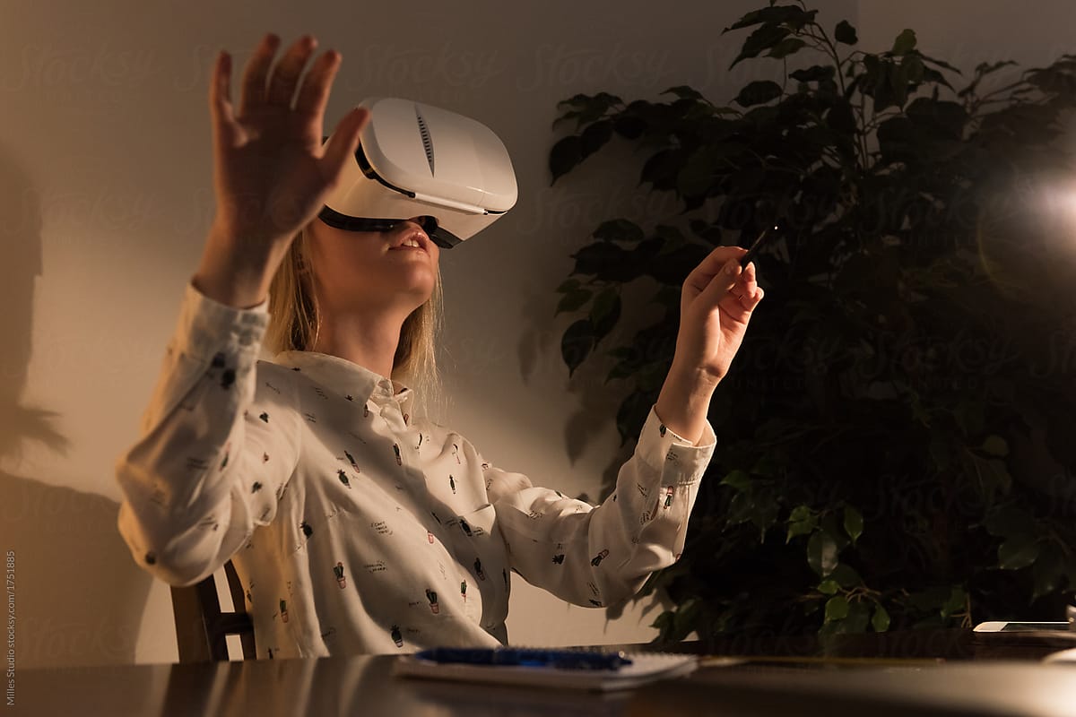 Woman experiencing virtual reality at home