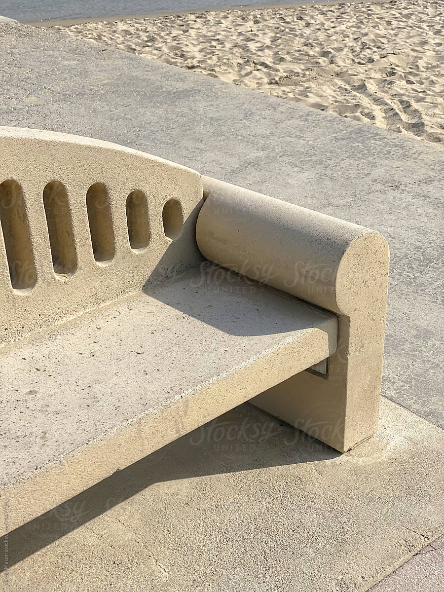 tan public bench at a beach