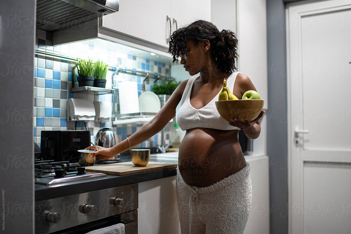 Pregnant woman in kitchen