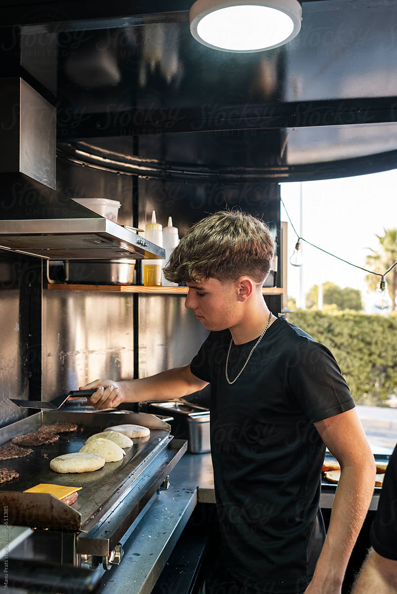Teen chef cooking in a small business food truck