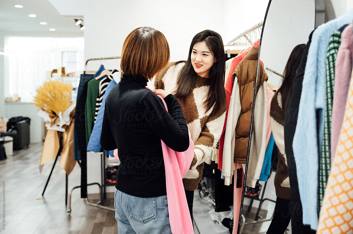 Fashion girls shopping in clothing store