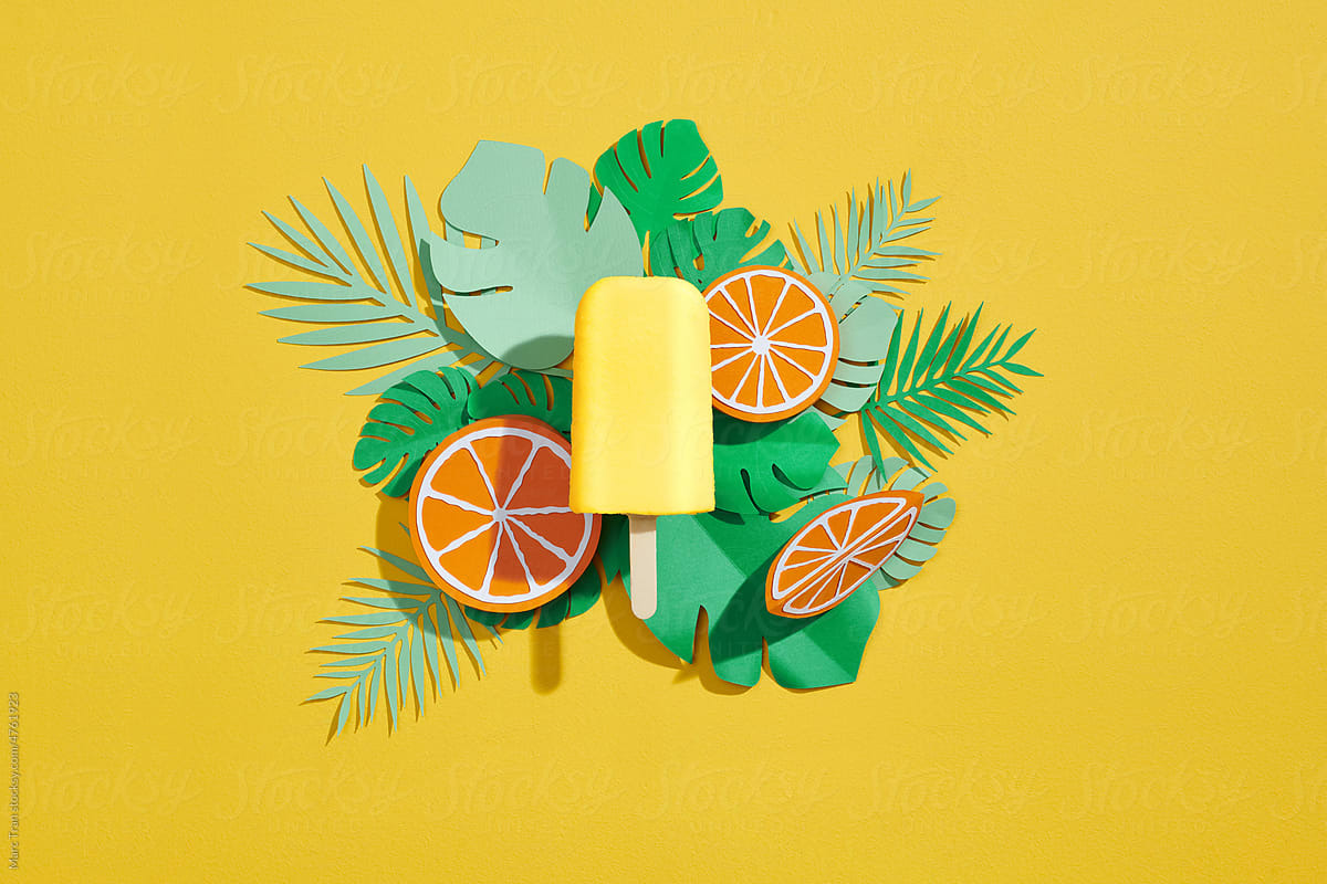 Tropical fruit popsicles on ice. Cold summer fruit sweets.