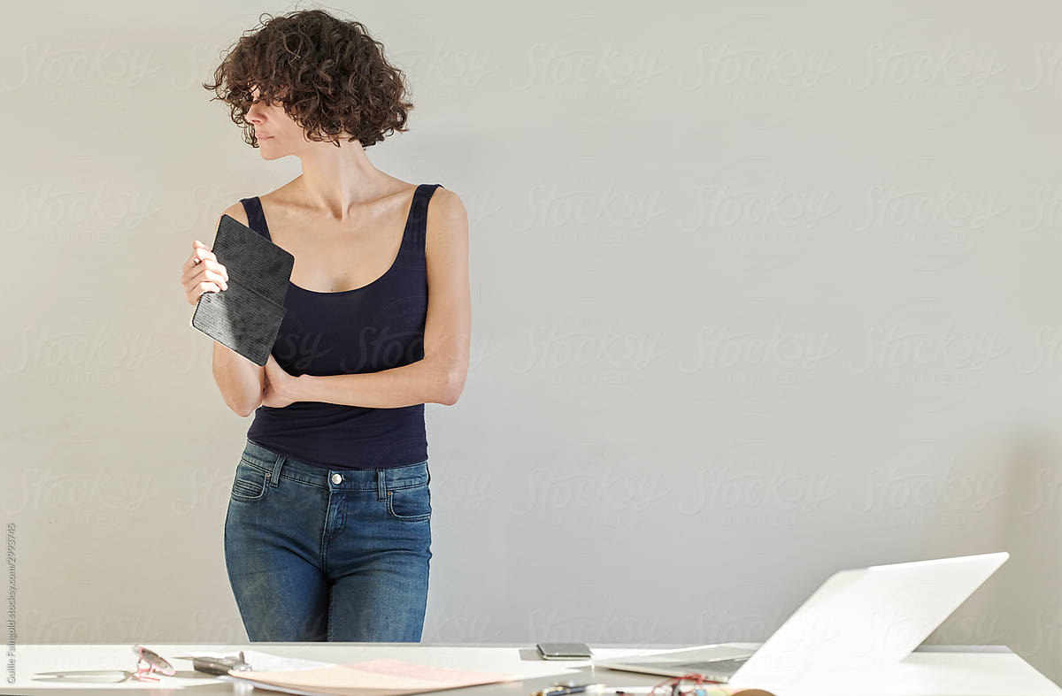 Businesswoman in casual clothing with a planner.