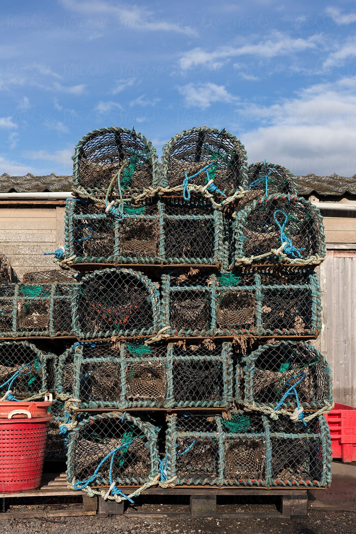 Lobster, Crab and Crayfish traps stacked  to dry outside a fisherman\'s  hut
