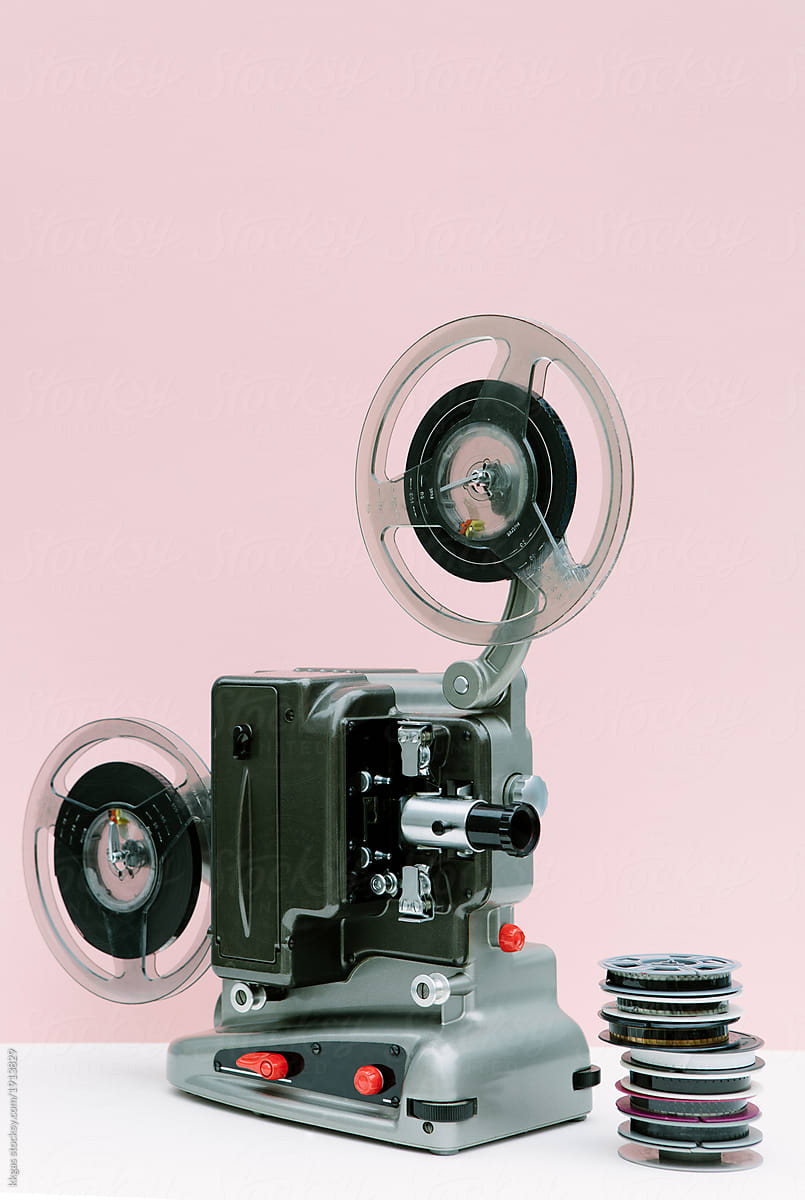 Vintage cinema projector and movie reels