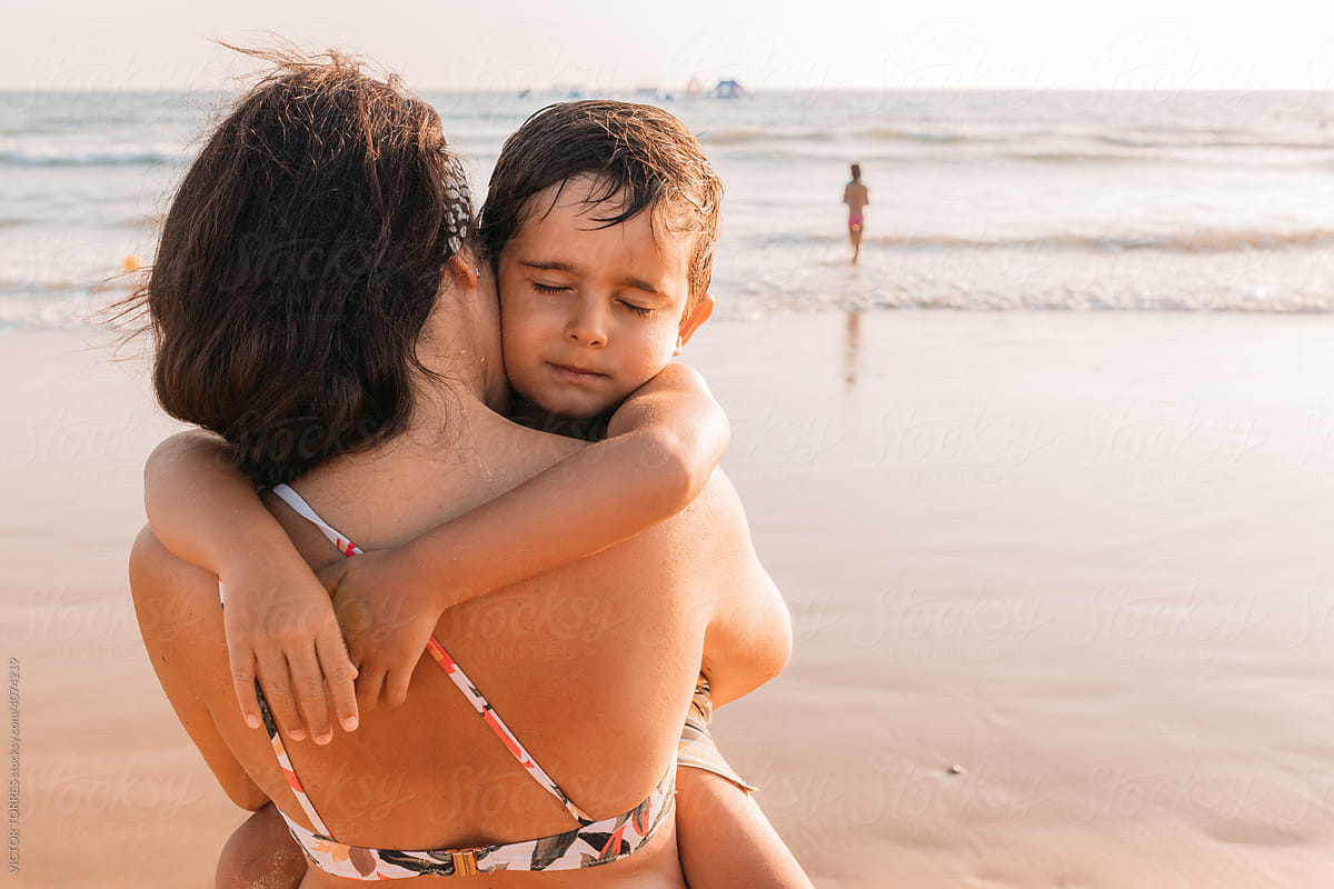 Mother with child on beach