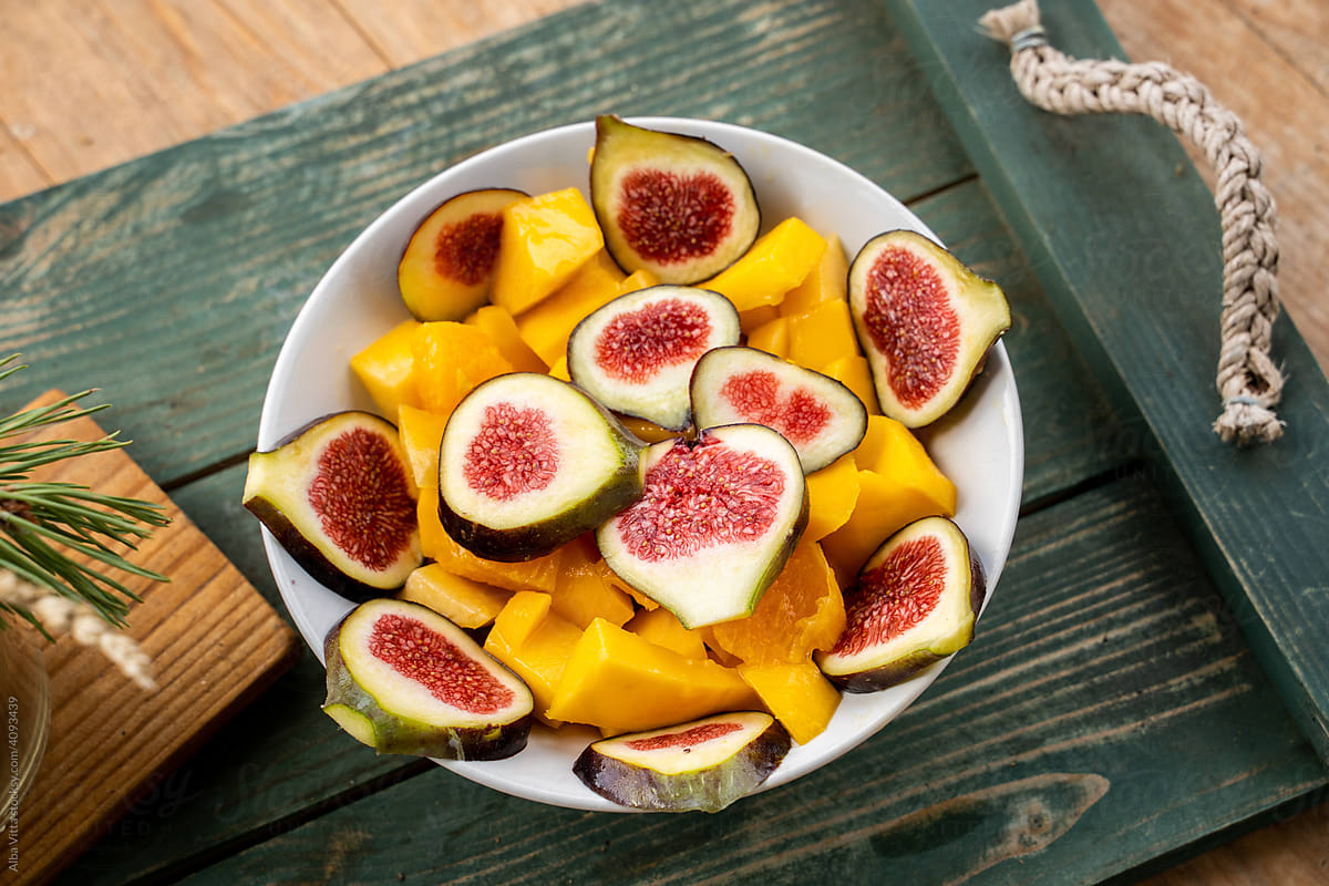 Above angle of yummy fruit salad with figs and mango