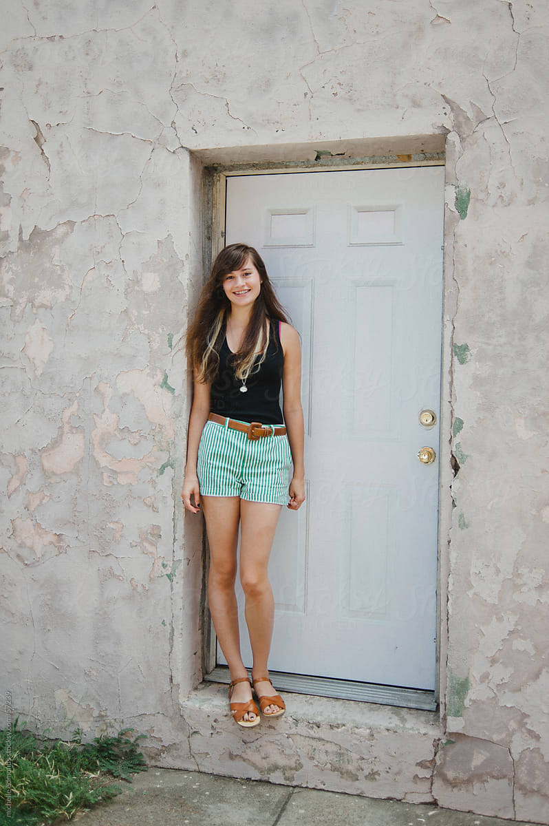 Girl Standing In Doorway Downtown By Stocksy Contributor Michelle Edmonds Stocksy 8620