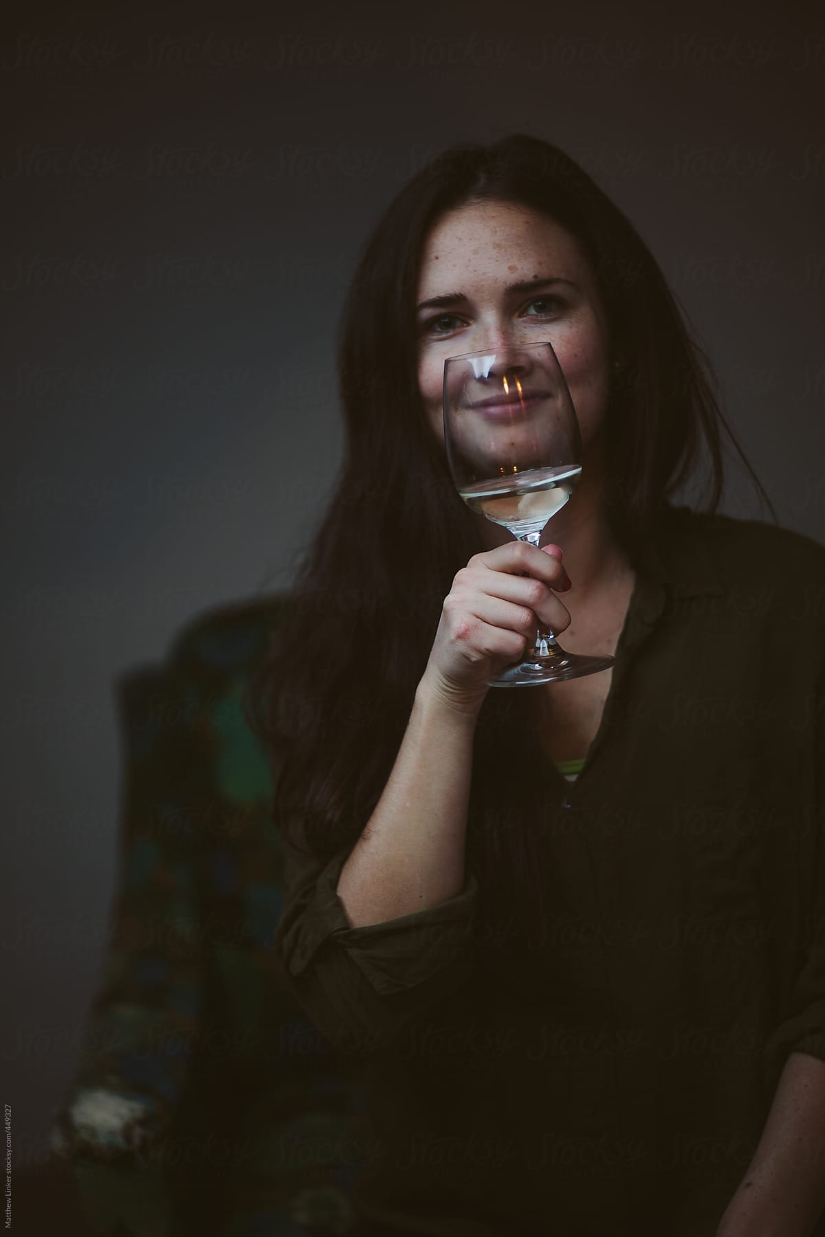 Young woman enjoying a glass of wine