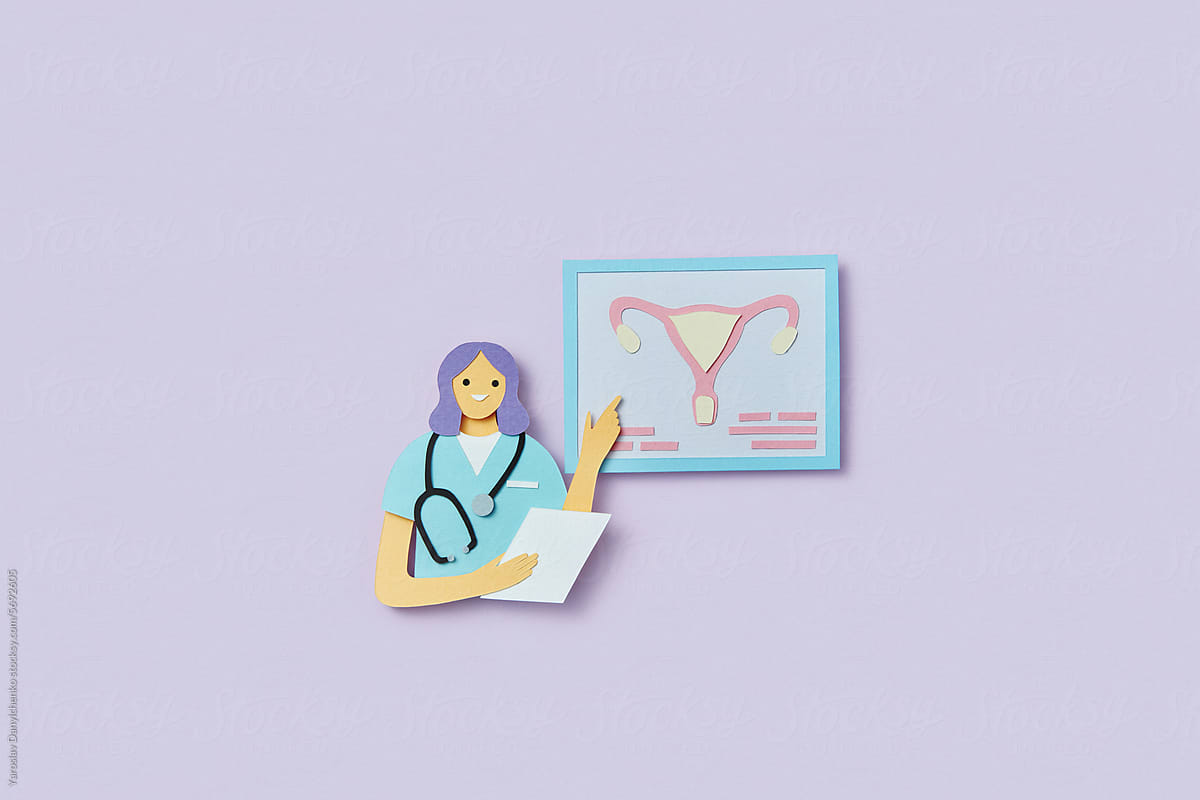 Papercraft composition of gynecologist pointing on female uterus