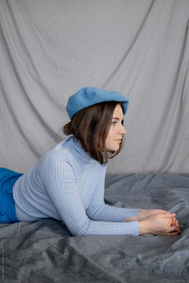 Woman In Turtleneck and Beret Lying Down