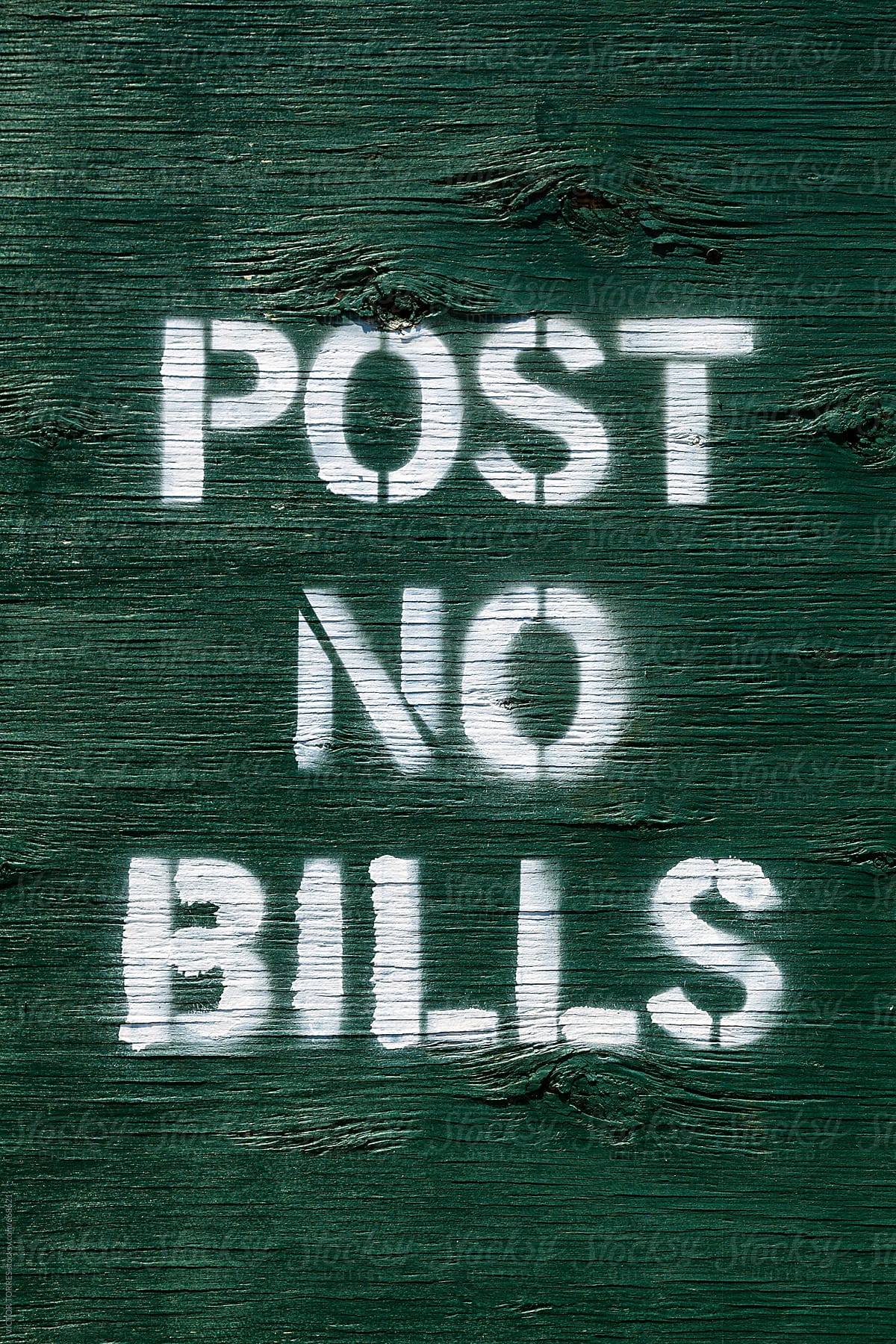 Post No Bills Message on a Green Wooden Wall