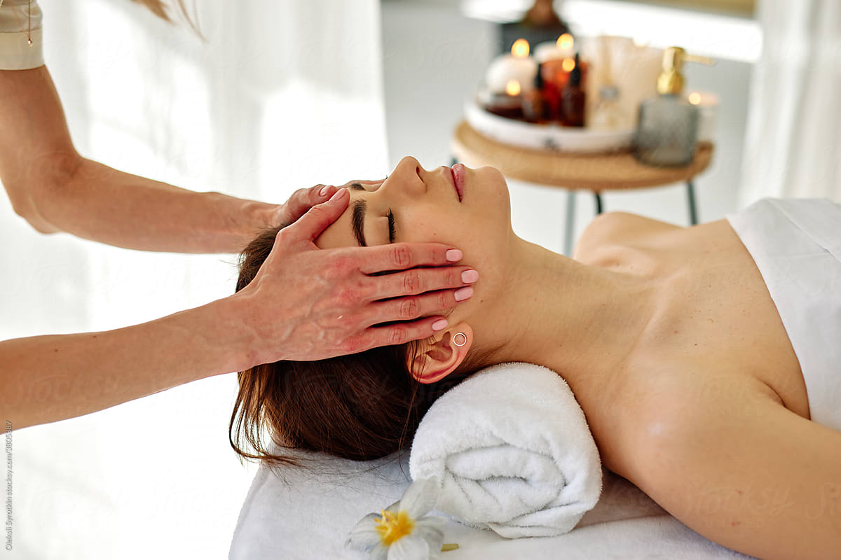 Woman relaxing during face massage