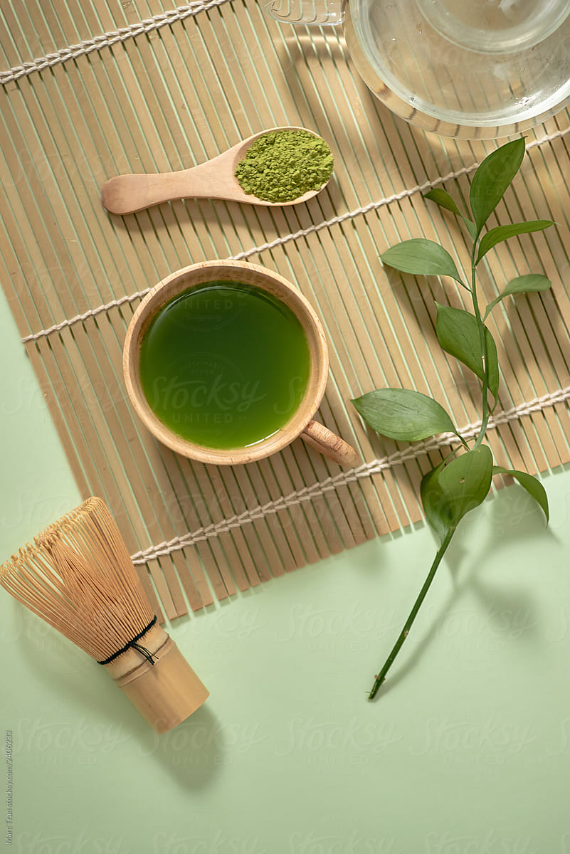 Green matcha tea drink and tea accessories.