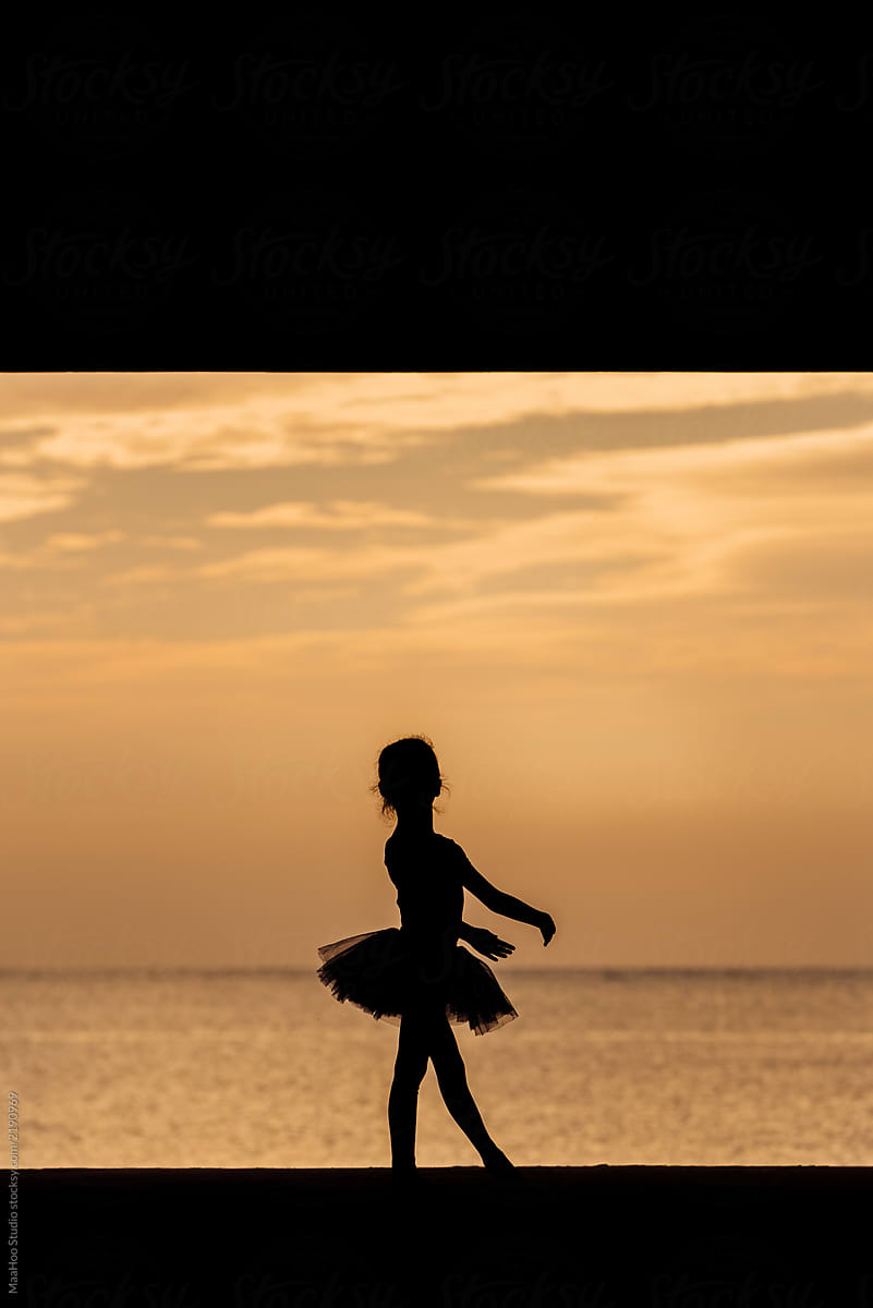 Cute girl dancing on the seaside