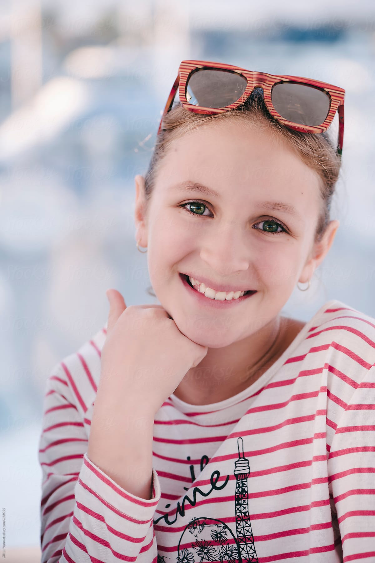 Portrait Of Tween Girl With Sunglasses And A Stripy Top By Stocksy