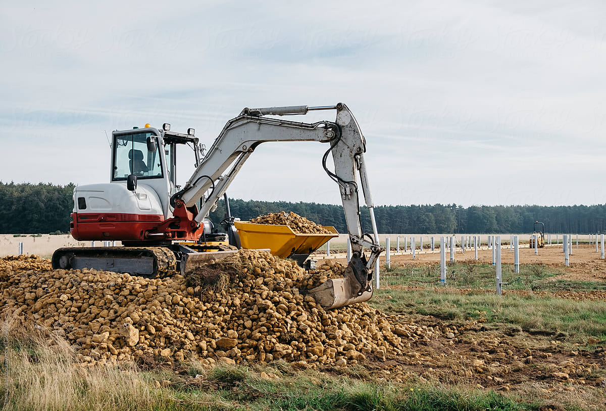 Digger and dumper on a construction site. Norfolk, UK.