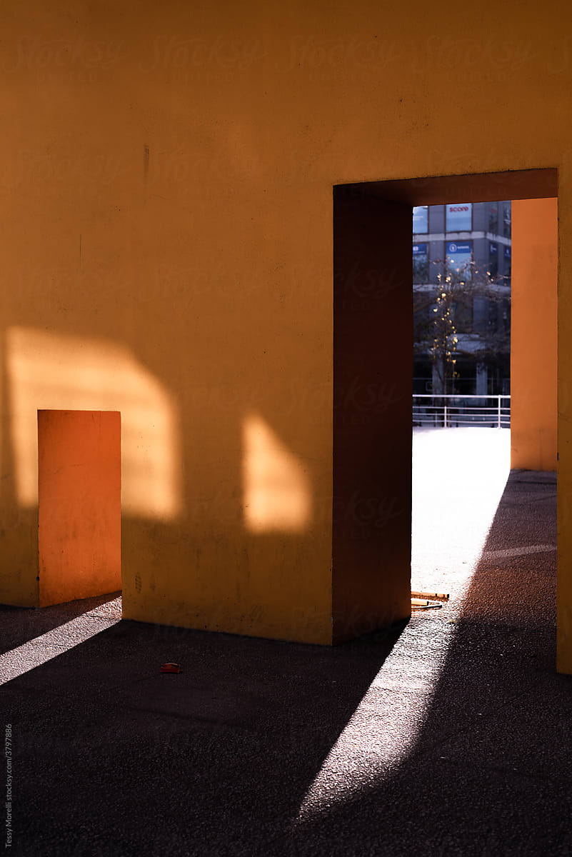 Shadows and contrasts on a yellow wall