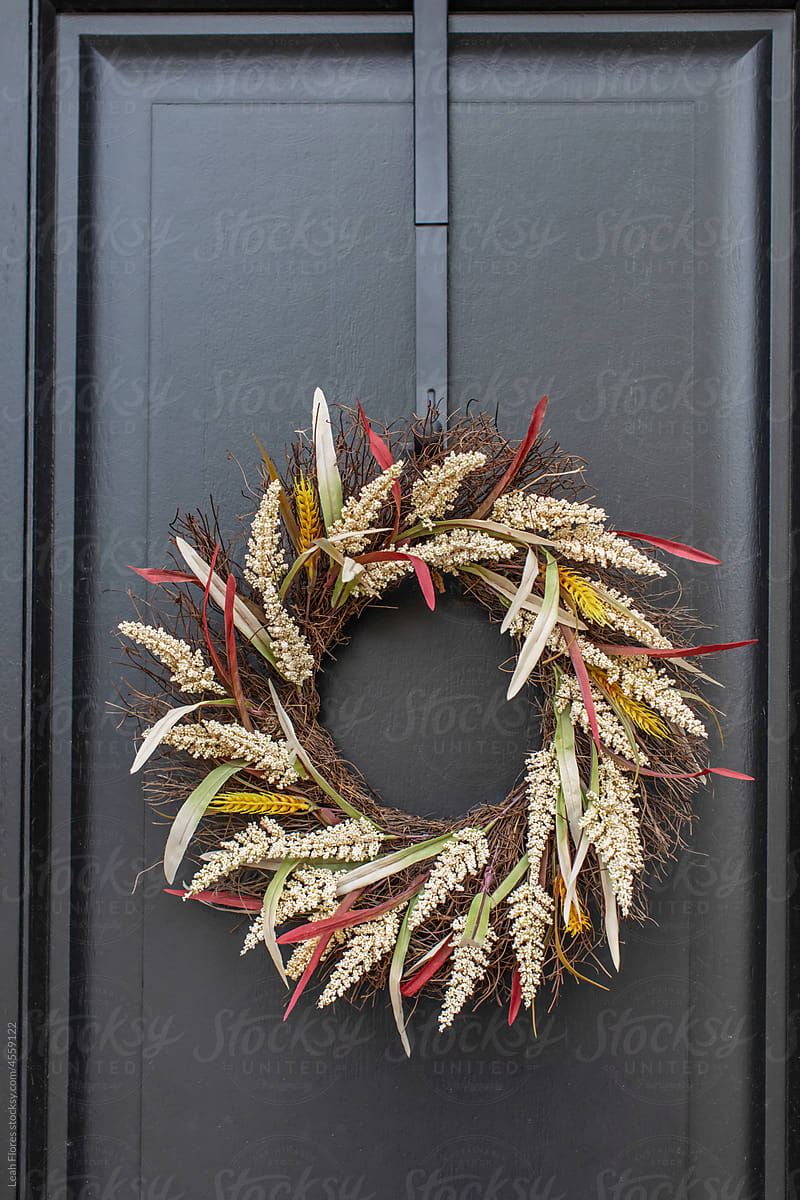 Closeup of Modern, Black Front Door with Autumn Wreath