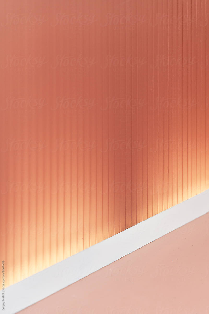 Warm pink wall with white molding