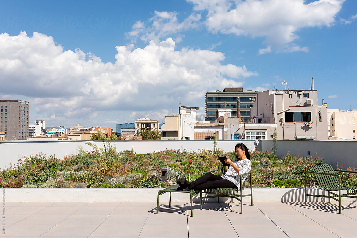 woman relaxing at rooftop