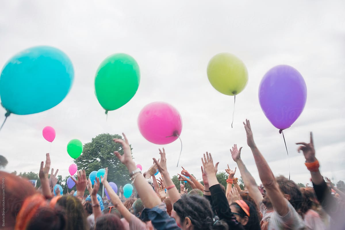 Colorful balloons in the air at an outdoors party