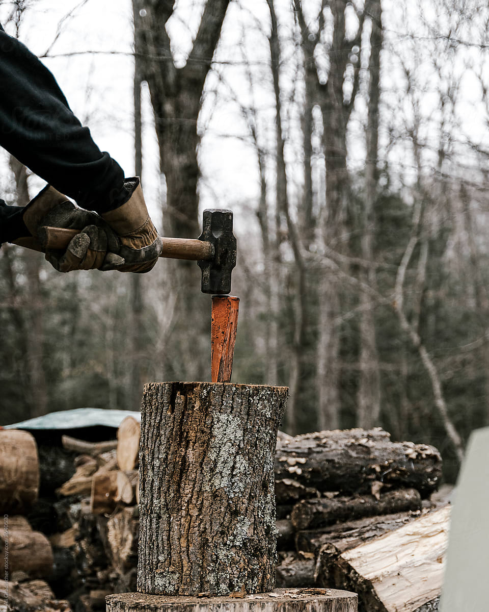 A Hammer and Wedge Splitting a Log